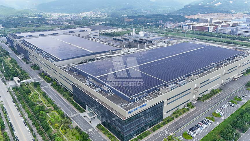 Aerial view: BOE factory featuring extensive Mibet Energy rooftop solar installation.